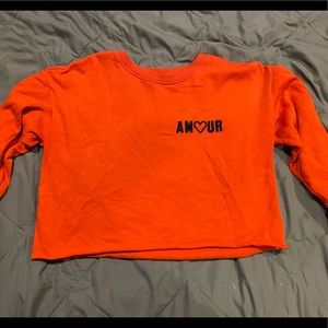 Bright, long sleeved crop top
